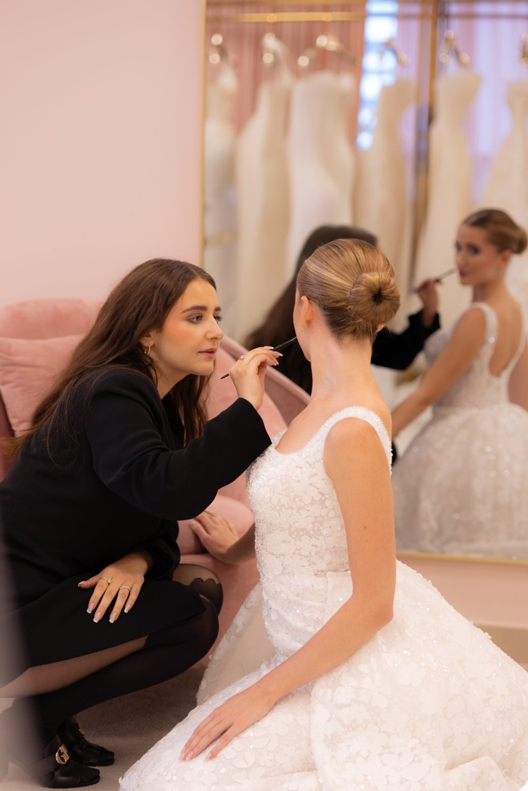 Caroline applying bridal makeup