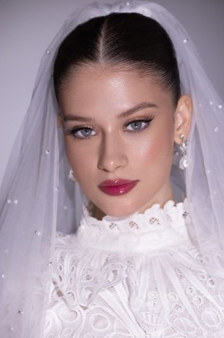 Bridal makeup with high-neck lace gown